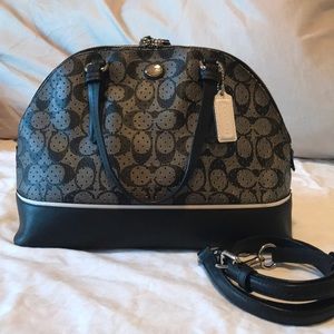 Black perforated leather Coach half dome bag.